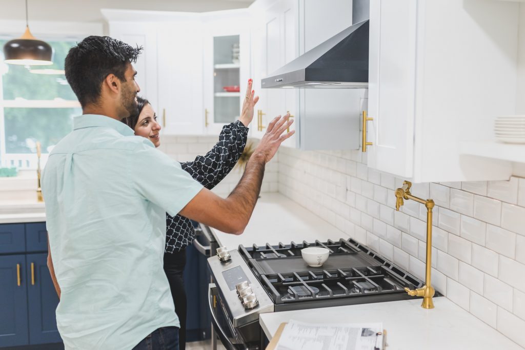A couple reviewing home improvement plans at a table