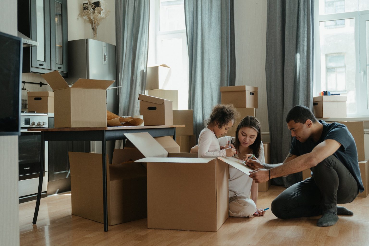 Houston family unpacking boxes in their new home