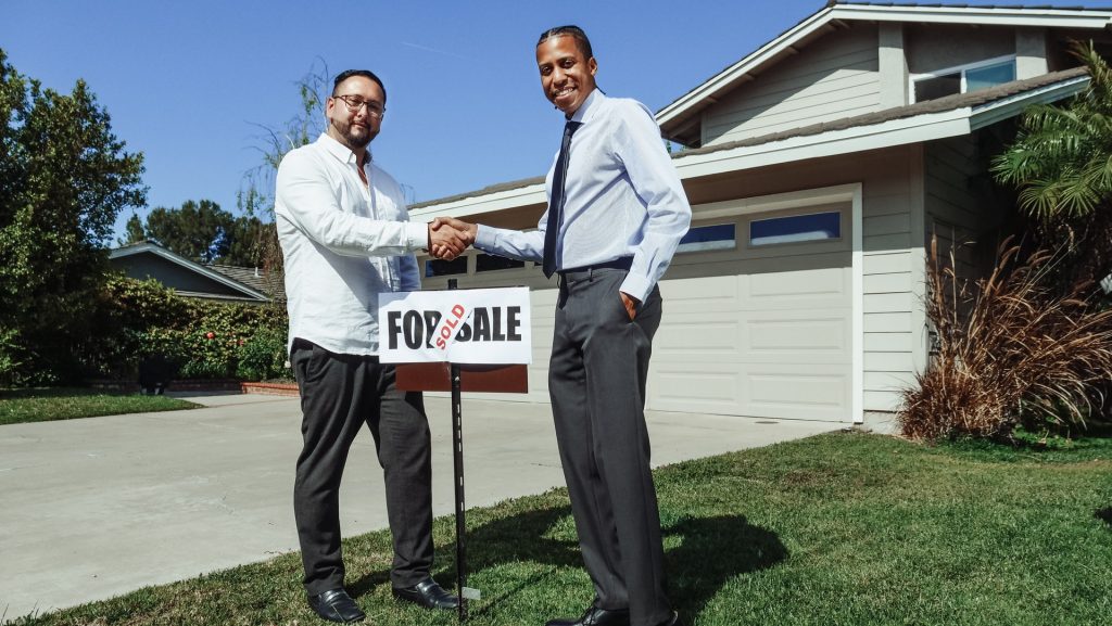 Buyers discussing financing options in a meeting